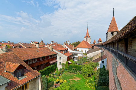 Defensive walls and red roofs of old town Murten in Switzerland.の写真素材