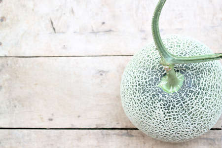 Melon on a wooden floorの写真素材