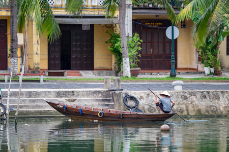 HOIAN, VIETNAM, MAY 15: Unidentified woman on boats on Thu Bon river in ancient Hoian town.のeditorial素材