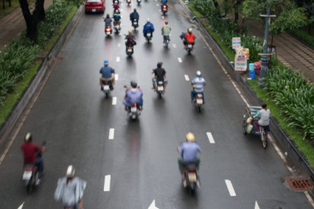 HO CHI MINH, VIETNAM - MAY 11 2017: Undefined motorcycle traffic in rain. Is located in the South of Vietnam, is the country's largest city, population 8 millionのeditorial素材