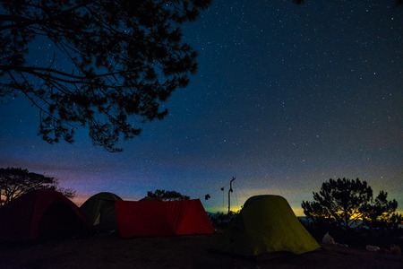 Night camping. Royalty free stock photo in no time. Tent camping under starry nightの写真素材