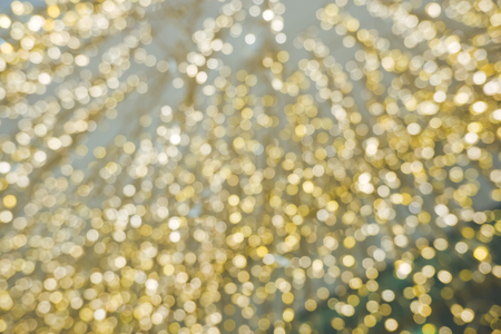 Christmas light background. Holiday glowing backdrop. Defocused Background With Blinking Stars. Blurred bokeh abstract blurred light element for cover decoration or backgroundの写真素材