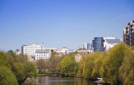 City park with river in summer dayの写真素材