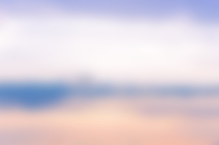 Blurry photo of the sky and clouds in soft colorsの写真素材