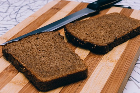 Photo of the bread and knife with selective focusの写真素材
