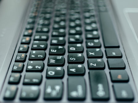 Black computer laptop keyboad with selective focus