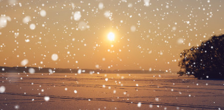 beautifu sunset on the frozen lake in winter snowfall timeの写真素材