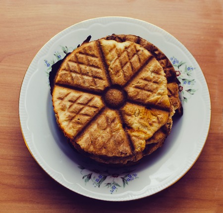Plate with tasty cookies on the hone kitchen table, with vintage filterの写真素材