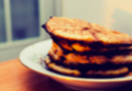 Abstract blurred defocused effect on the home plate with cookies