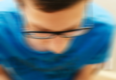 Abstract blurred defocused motion effect on the photo with young manの写真素材