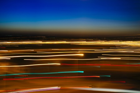 Abstract colorful backdrop, light painting photography - freezelight of the night city motionの写真素材