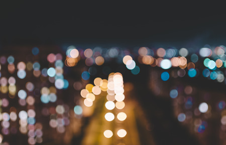 Blurred defocused photo of the night city with bokeh effectの写真素材
