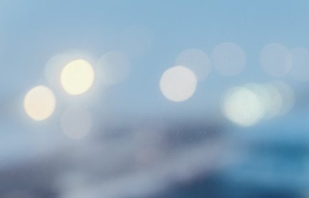 Defocused winter city night filtered bokeh abstract backgroundの写真素材