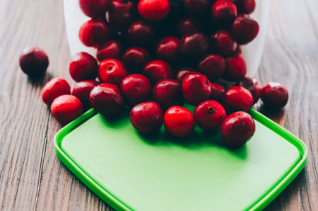 Fresh cherry in box on the wood tableの写真素材