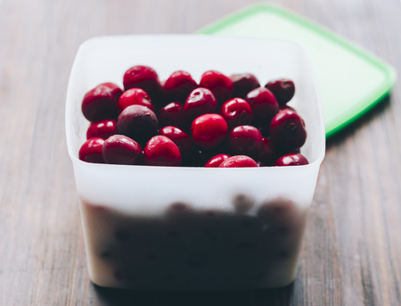 Fresh cherry in box on the wood tableの写真素材