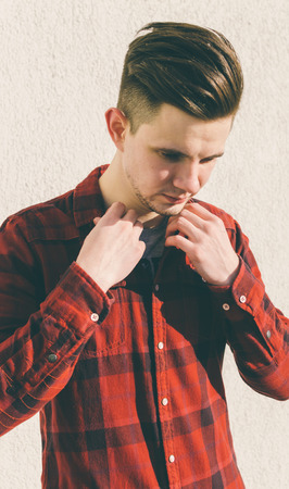 Young man dress a red vintage shirtの写真素材