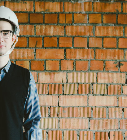 Portrait of the half face young man engineer