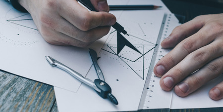Man drawing a scetch on the white pepperの写真素材