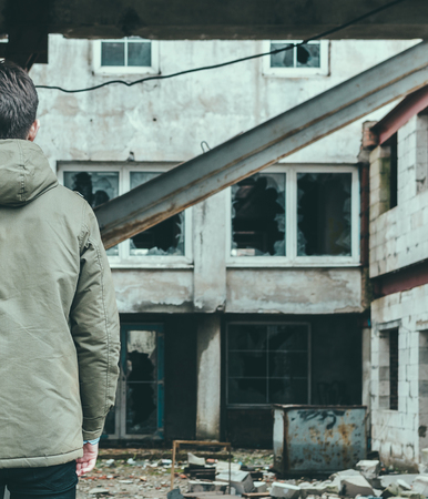 Half of the young man on the old abandoned plantの写真素材