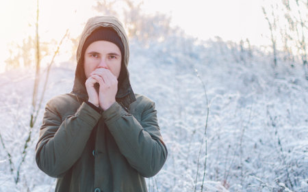Winter portrait of the man in forest