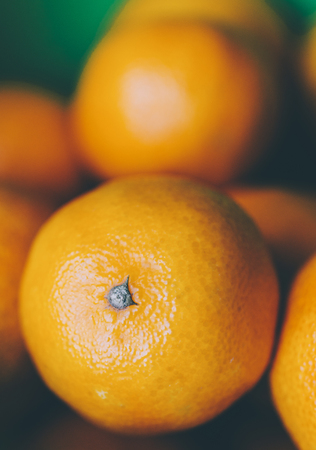 Mandarins in plate on home kitchen tableの写真素材