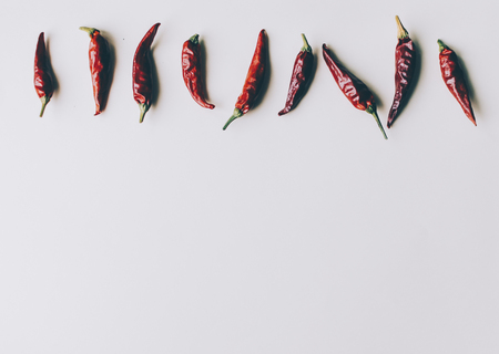 Red hot chili peppers on the white backgroundの写真素材
