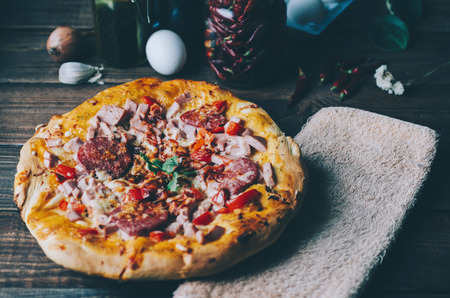 Home made pizza on the black rustic backgroundの写真素材