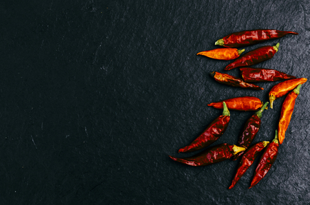 Red dry pepper on the dark black backgroundの写真素材