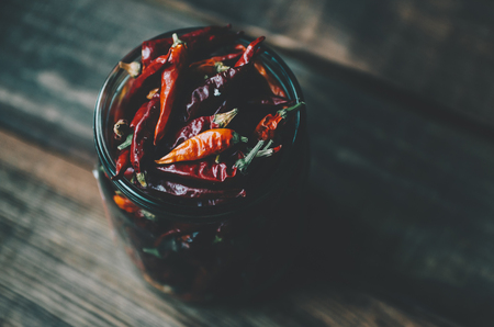 Dry red pepper on the wood rustic tableの写真素材