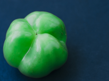 Green pepper on the black background tableの写真素材