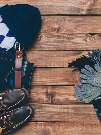 Outfit man autumn clothes on wooden backgroundの写真素材