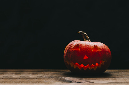 Halloween Pumpkin On rustic Wood and black backgroundの写真素材