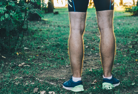 Running man in city park in sunset timeの写真素材