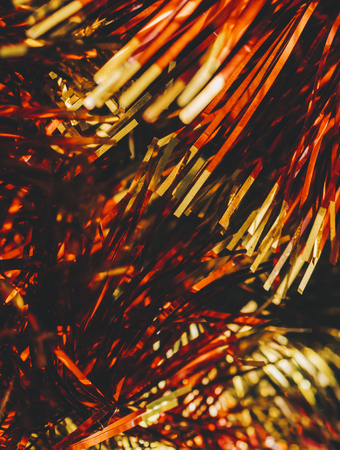 Christmas ren, gold and green decoration tinsel fore treeの写真素材