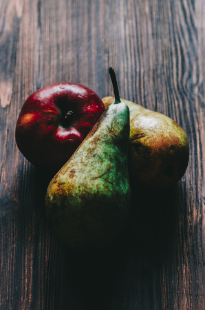 Apple And pear on wooden rustic backgroundの写真素材