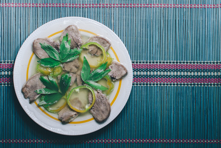 Aspic with meat on the blue wooden deskの写真素材