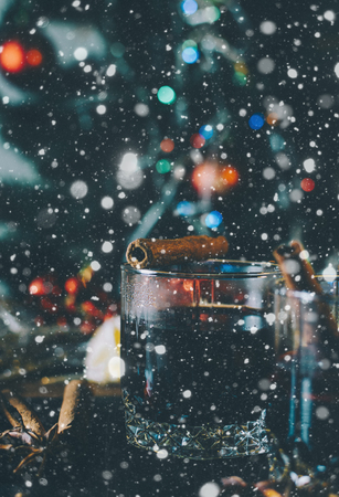Glasses with mulled wine on the wooden desk in christmas timeの写真素材