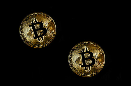 Golden bitcoin on black background. Bitcoin cryptocurrency.の写真素材