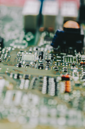 Detail of an electronic printed circuit board with many electrical componentsの写真素材