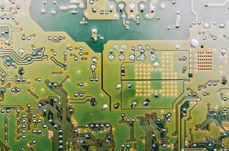 Detail of an electronic printed circuit board with many electrical componentsの写真素材