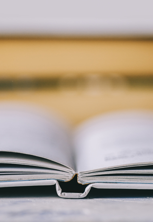 Old book from home library on tableの写真素材