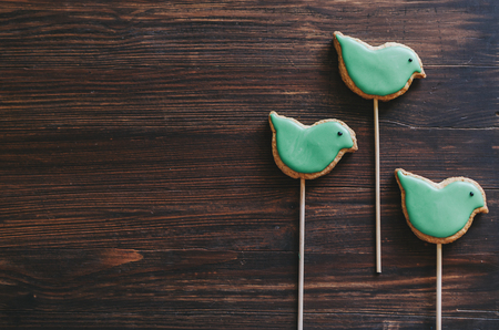 Birds ginger cookies on wooden rustic tableの写真素材