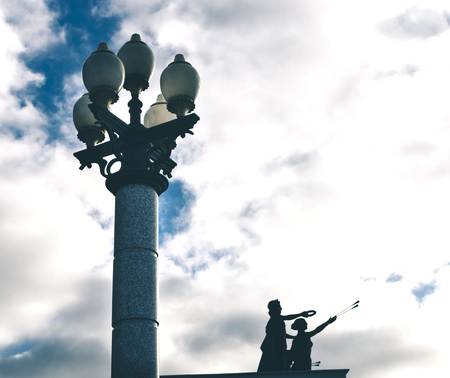 Vintage lamp post over blue sky with cloudsの写真素材
