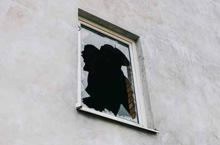 Old vintage window with broken glass