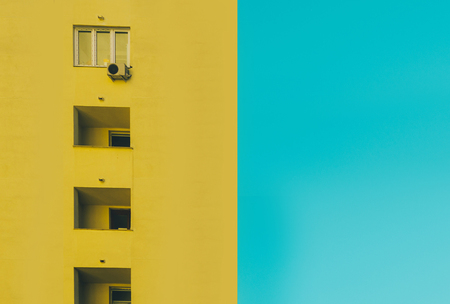 Yellow building with blue sky background. Ideal use for background.の写真素材
