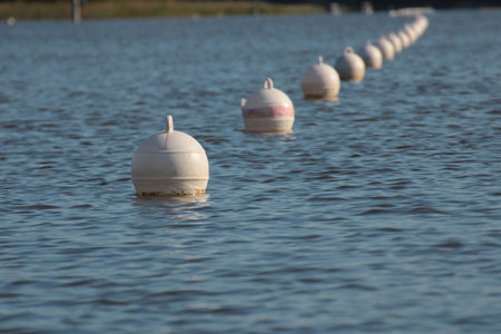 White buoy floating on the water in a lake in the Netherlands.