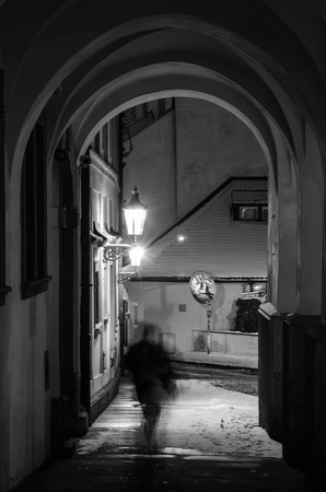Old, ancient city with ghost in night in winter with snow and shining lanternの写真素材