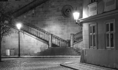 Old, ancient city in night, shining lantern, stairs, BWの写真素材