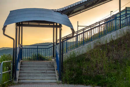 External staircase covered with a metal roof.