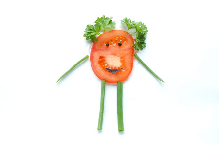 Funny vegetable snack for kids on white backgroundの写真素材
